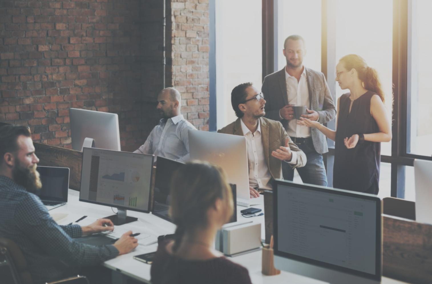 Course participants reviewing campaign metrics